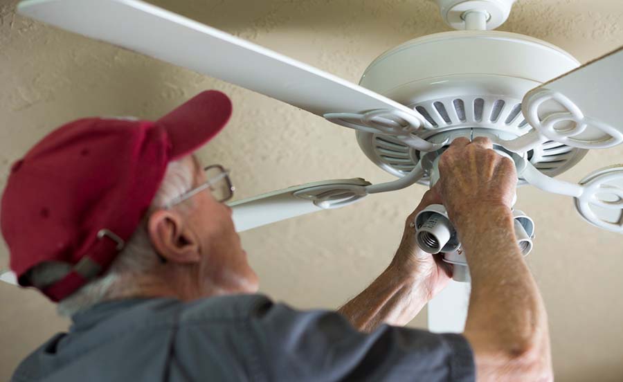 person installing ceiling fan lg