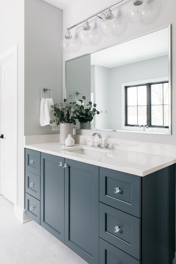 Grays Harbor is one of the most beautiful blue gray paint colors for cabinets on this stunning bathroom vanity