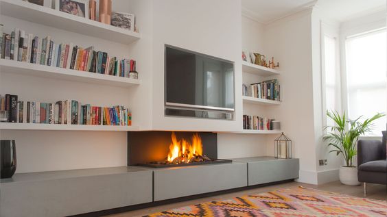 electric fireplace ideas with TV above and side bookcases