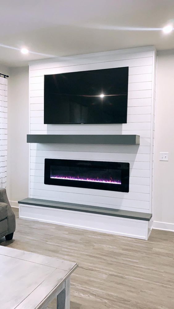 white shiplap electric fireplace ideas with TV above