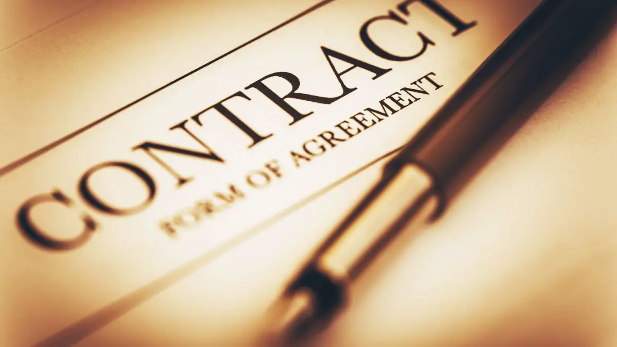 contract of agreement papers an a pen