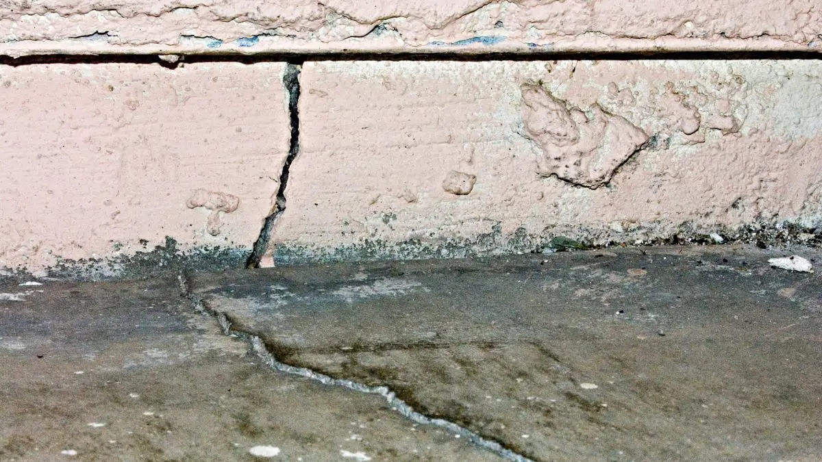 Foundation problems after closing - A large crack on the foundation floor and walls of a house